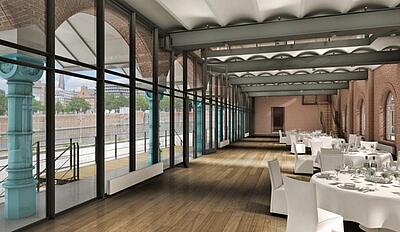 Innenansicht des ehemaligen Hauptzollamts in Hamburg Innenansicht mit Tischen und Glasfassade im ehemaligen Hauptzollamts in Hamburg